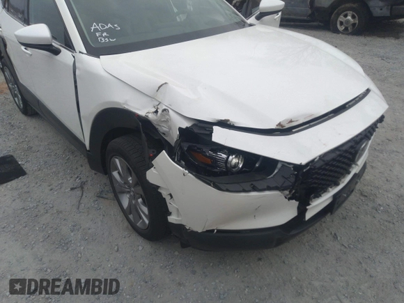 2021 Mazda CX-30 Premium with VIN 3MVDMADL5MM318729, listed as a IAAI auction lot 41645560 with 51,132 mi miles and . Bid and sale history available at DreamBid. Image 6.