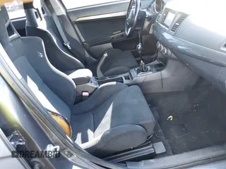 2008 Mitsubishi Lancer Evolution GSR with VIN JA3AW86V18U044077, listed as a IAAI auction lot 41208625 with 157,788 mi miles. Bid and sale history available at carsss.com. Image 5.