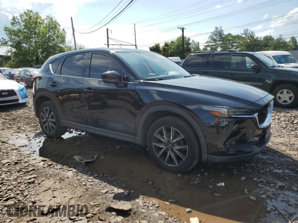 2018 Mazda CX-5 Grand Touring with VIN JM3KFBDM6J0345848, listed as a Copart auction lot 61587865 with 107,193 mi miles and Salvage title. Bid and sale history available at DreamBid. Image 4.