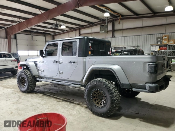 2021 Jeep Gladiator Freedom с VIN 1C6HJTAG2ML579159, выставлен на аукционе Copart как лот 42954605 с пробегом 66 865 миль миль и Списание • Salvage title. История ставок и продаж доступна на DreamBid. Изображение 2.