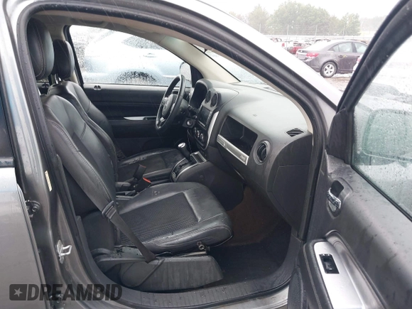 2014 Jeep Compass Latitude with VIN 1C4NJCEB2ED522109, listed as a IAAI auction lot 40282558 with 168,954 mi miles and . Bid and sale history available at carsss.com. Image 5.