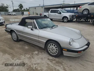 1990 Alfa Romeo Spider z VIN ZARBA12T0L6002373, wystawiony jako Copart lot #75362404 z przebiegiem 73 479 mil mil oraz Nie do naprawy • Non repairable. Historia ofert i sprzedaży dostępna na DreamBid. Obrazek 4.