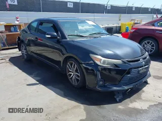 2014 Scion tC with VIN JTKJF5C71E3072199, listed as a IAAI auction lot 41956178 with 154,730 mi miles. Bid and sale history available at carsss.com. Image 1.