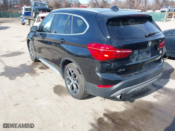 2019 BMW X1 xDrive28i with VIN WBXHT3C51K5L89758, listed as a IAAI auction lot 41535652 with 96,612 mi miles. Bid and sale history available at carsss.com. Image 3.