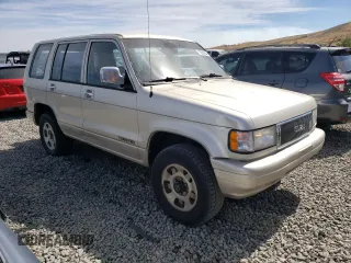 1994 Isuzu Trooper z VIN JACDH58V7R7929502, wystawiony jako Copart lot #70280554 z przebiegiem 243 827 mil mil oraz Tytuł czysty. Historia ofert i sprzedaży dostępna na DreamBid. Obrazek 4.
