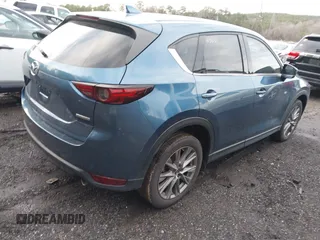 2020 Mazda CX-5 Grand Touring with VIN JM3KFADM4L0827733, listed as a IAAI auction lot 41482517 with 43,597 mi miles. Bid and sale history available at carsss.com. Image 4.