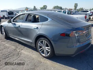 2014 Tesla Model S 60 with VIN 5YJSA1S11EFP35998, listed as a IAAI auction lot 42316563 with 83,835 mi miles and . Bid and sale history available at DreamBid. Image 3.