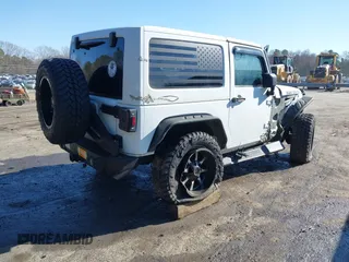 2014 Jeep Wrangler Sport with VIN 1C4AJWAG0EL245337, listed as a IAAI auction lot 41532314 with 140,721 mi miles and . Bid and sale history available at DreamBid. Image 4.