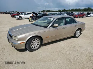2004 Jaguar XJ with VIN SAJWA71C24SG28164, listed as a Copart auction lot 73968134 with 0 mi miles and Salvage Title. Bid and sale history available at carsss.com. Image 1.