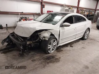 2014 Volkswagen CC Lux with VIN WVWRP7AN9EE519502, listed as a IAAI auction lot 41458158 with 85,988 mi miles. Bid and sale history available at carsss.com. Image 2.