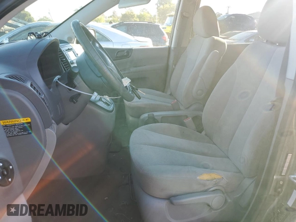 2010 Kia Sedona LX with VIN KNDMG4C39A6351207, listed as a Copart auction lot 76838564 with 210,642 mi miles and Salvage Title. Bid and sale history available at carsss.com. Image 7.