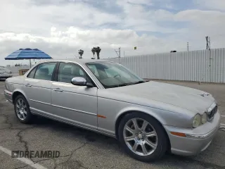2004 Jaguar XJ Vanden Plas with VIN SAJWA74C04SG25291, listed as a Copart auction lot 56678255 with 176,597 mi miles and Clean Title. Bid and sale history available at DreamBid. Image 4.