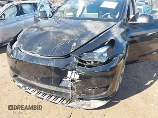 2024 Tesla Model Y with VIN 7SAYGDED5RF093018, listed as a IAAI auction lot 41747467 with 60,469 mi miles and . Bid and sale history available at DreamBid. Image 6.
