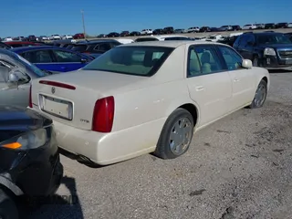 2000 Cadillac DeVille DTS z VIN 1G6KF5793YU222306, wystawiony jako IAAI lot #40810291 z przebiegiem 140 019 mil mil oraz . Historia ofert i sprzedaży dostępna na DreamBid. Obrazek 4.