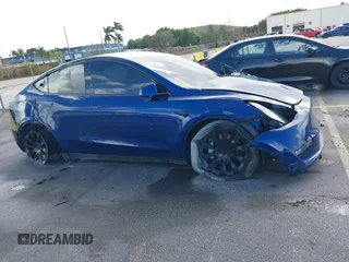 2021 Tesla Model Y Standard Range with VIN 5YJYGDED4MF112857, listed as a IAAI auction lot 41134600 with Not Provided miles and . Bid and sale history available at DreamBid. Image 12.