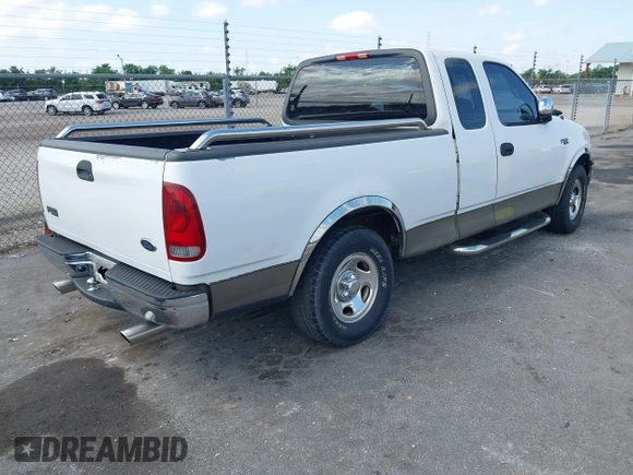 2002 Ford F-150 XL with VIN 1FTRX17242NA69697, listed as a IAAI auction lot 42038258 with 207,008 mi miles. Bid and sale history available at carsss.com. Image 4.