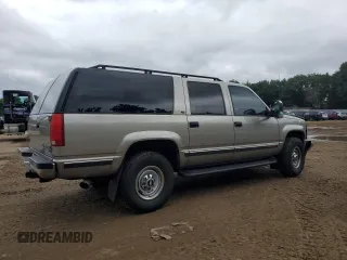 1999 Chevrolet Suburban with VIN 1GNGK26J0XJ439859, listed as a Copart auction lot 69076004 with 277,201 mi miles and Salvage Title. Bid and sale history available at carsss.com. Image 3.
