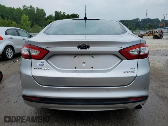 2014 Ford Fusion SE Hybrid с VIN 3FA6P0LU0ER374013, выставлен на аукционе Copart как лот 57494135 с пробегом Не указан миль и Списание • Salvage title. История ставок и продаж доступна на DreamBid. Изображение 6.