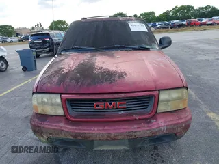 1998 GMC Jimmy SL with VIN 1GKCS13W8W2510773, listed as a IAAI auction lot 41675219 with 38,718 mi miles. Bid and sale history available at carsss.com. Image 6.