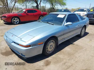 1989 Toyota Supra z VIN JT2MA71J7K0107654, wystawiony jako IAAI lot #42078617 z przebiegiem 181 176 mil mil oraz . Historia ofert i sprzedaży dostępna na DreamBid. Obrazek 2.