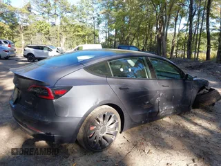 2022 Tesla Model 3 Performance with VIN 5YJ3E1EC7NF329679, listed as a IAAI auction lot 40555901 with 32,552 mi miles and . Bid and sale history available at DreamBid. Image 4.