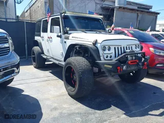 2015 Jeep Wrangler Unlimited Sport with VIN 1C4BJWDG0FL664242, listed as a IAAI auction lot 41757380 with 84,009 mi miles. Bid and sale history available at carsss.com. Image 1.