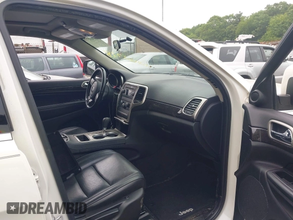 2011 Jeep Grand Cherokee Laredo with VIN 1J4RR4GG0BC670506, listed as a IAAI auction lot 42462778 with 241,406 mi miles and . Bid and sale history available at DreamBid. Image 5.