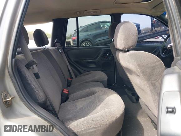 2000 Jeep Grand Cherokee Laredo with VIN 1J4GW48N5YC322707, listed as a IAAI auction lot 42080677 with Not provided miles and . Bid and sale history available at DreamBid. Image 8.