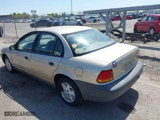 1996 Saturn SL with VIN 1G8ZH5288TZ230864, listed as a IAAI auction lot 42116703 with 104,387 mi miles. Bid and sale history available at carsss.com. Image 3.
