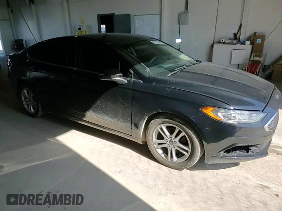 2018 Ford Fusion SE z VIN 3FA6P0HDXJR130677, wystawiony jako Copart lot #51737345 z przebiegiem 129 918 mil mil oraz Szkoda całkowita • Salvage title. Historia ofert i sprzedaży dostępna na DreamBid. Obrazek 10.