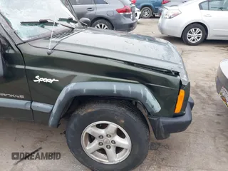 1997 Jeep Cherokee Sport with VIN 1J4FJ68SXVL582060, listed as a IAAI auction lot 41333519 with 183,580 mi miles. Bid and sale history available at carsss.com. Image 14.