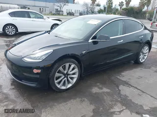 2020 Tesla Model 3 Standard Range Plus with VIN 5YJ3E1EA8LF645569, listed as a IAAI auction lot 41697452 with 84,590 mi miles. Bid and sale history available at carsss.com. Image 19.