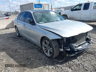2015 BMW 3 Series 328i with VIN WBA3A5C55FF609490, listed as a IAAI auction lot 42006008 with 110,239 mi miles. Bid and sale history available at carsss.com. Image 1.