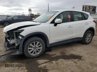 2015 Mazda CX-5 Sport z VIN JM3KE4BY2F0516574, wystawiony jako Copart lot #84100544 z przebiegiem Nie podano mil oraz Szkoda całkowita • Salvage title. Historia ofert i sprzedaży dostępna na DreamBid. Obrazek 1.