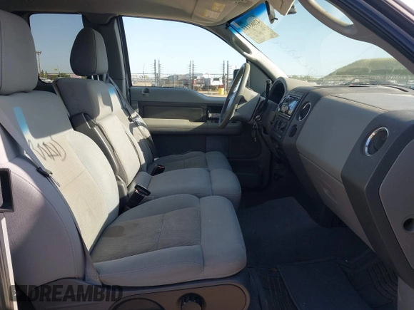 2004 Ford F-150 XL with VIN 1FTPX12594NA32477, listed as a IAAI auction lot 42088113 with 266,389 mi miles. Bid and sale history available at carsss.com. Image 5.