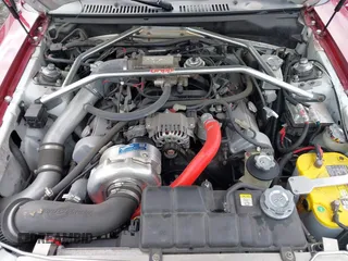 2002 Ford Mustang GT Deluxe z VIN 1FAFP45X62F165902, wystawiony jako IAAI lot #41814507 z przebiegiem 129 528 mil mil oraz . Historia ofert i sprzedaży dostępna na DreamBid. Obrazek 10.