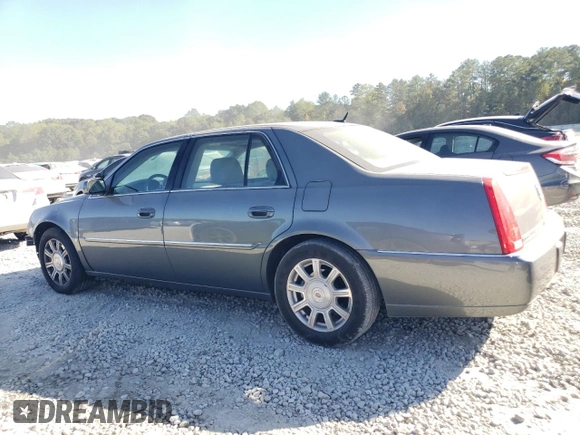 2008 Cadillac DTS 1SD z VIN 1G6KD57Y68U140938, wystawiony jako Copart lot #77525974 z przebiegiem 148 132 mil mil oraz Szkoda całkowita • Salvage title. Historia ofert i sprzedaży dostępna na DreamBid. Obrazek 2.