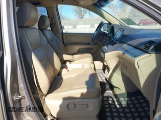 2010 Honda Odyssey EX-L with VIN 5FNRL3H79AB048049, listed as a IAAI auction lot 41440910 with 142,385 mi miles. Bid and sale history available at carsss.com. Image 5.