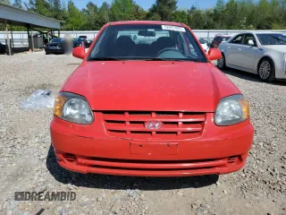2005 Hyundai Accent GLS with VIN KMHCG45C15U592443, listed as a Copart auction lot 52291025 with 142,263 mi miles and Salvage Title. Bid and sale history available at carsss.com. Image 5.