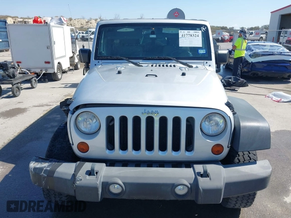 2010 Jeep Wrangler Unlimited Sport with VIN 1J4BA3H17AL211887, listed as a IAAI auction lot 41778324 with 185,626 mi miles. Bid and sale history available at carsss.com. Image 12.