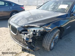 2012 BMW 7 Series 740i with VIN WBAKA4C51CC613636, listed as a IAAI auction lot 41908801 with 127,725 mi miles. Bid and sale history available at carsss.com. Image 6.