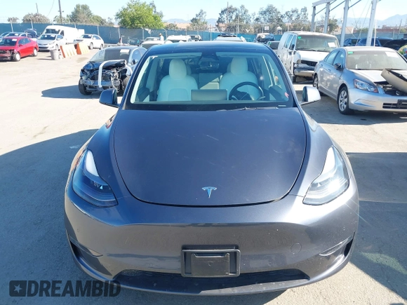 2022 Tesla Model Y Performance z VIN 7SAYGDEF2NF490794, wystawiony jako IAAI lot #42218742 z przebiegiem 41 402 mil mil oraz . Historia ofert i sprzedaży dostępna na DreamBid. Obrazek 12.
