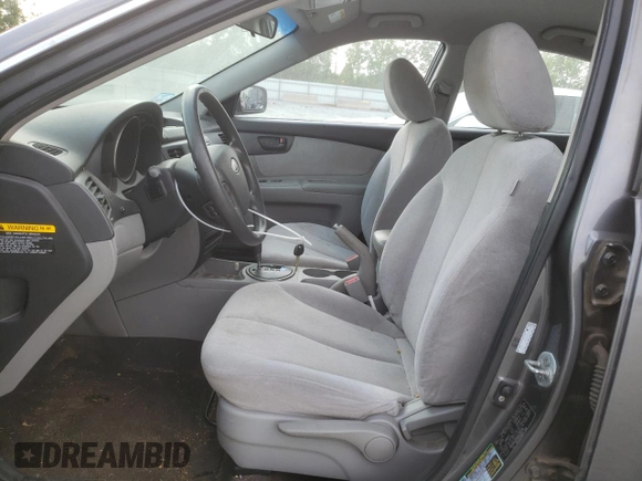 2009 Kia Optima LX z VIN KNAGE228695331919, wystawiony jako Copart lot #57804835 z przebiegiem 199 204 mil mil oraz Szkoda całkowita • Salvage title. Historia ofert i sprzedaży dostępna na DreamBid. Obrazek 7.