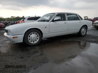 1999 Jaguar XJ with VIN SAJKD6041XC876928, listed as a Copart auction lot 60038405 with 63,917 mi miles and Clean title. Bid and sale history available at DreamBid. Image 1.
