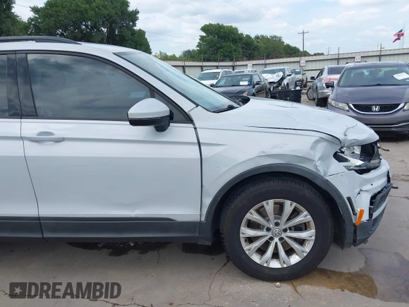 2018 Volkswagen Tiguan S with VIN 3VV1B7AX0JM092116, listed as a IAAI auction lot 42388339 with 103,412 mi miles and . Bid and sale history available at DreamBid. Image 6.
