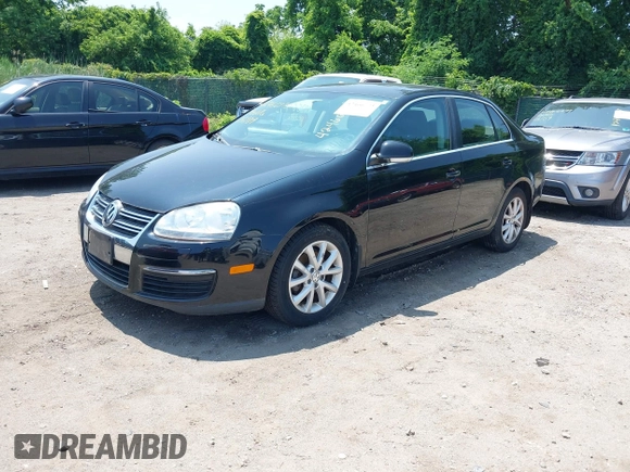 2010 Volkswagen Jetta SE z VIN 3VWRZ7AJ9AM042787, wystawiony jako IAAI lot #42466773 z przebiegiem 144 829 mil mil oraz . Historia ofert i sprzedaży dostępna na DreamBid. Obrazek 2.