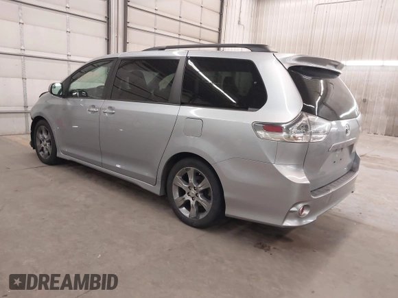 2015 Toyota Sienna SE with VIN 5TDXK3DC9FS527667, listed as a IAAI auction lot 41977729 with 230,933 mi miles and . Bid and sale history available at DreamBid. Image 3.