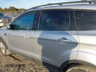 2014 Ford Escape SE with VIN 1FMCU9G96EUC53975, listed as a IAAI auction lot 41342661 with 128,594 mi miles. Bid and sale history available at carsss.com. Image 14.