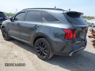 2023 Kia Sorento SX z VIN 5XYRK4LF0PG171635, wystawiony jako IAAI lot #42116649 z przebiegiem 75 348 mil mil oraz . Historia ofert i sprzedaży dostępna na DreamBid. Obrazek 3.