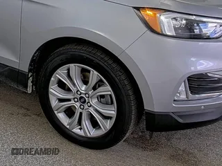 2022 Ford Edge Titanium z VIN 2FMPK4K98NBA81777, wystawiony jako IAAI lot #42254869 z przebiegiem 87 206 mil mil oraz . Historia ofert i sprzedaży dostępna na DreamBid. Obrazek 1.